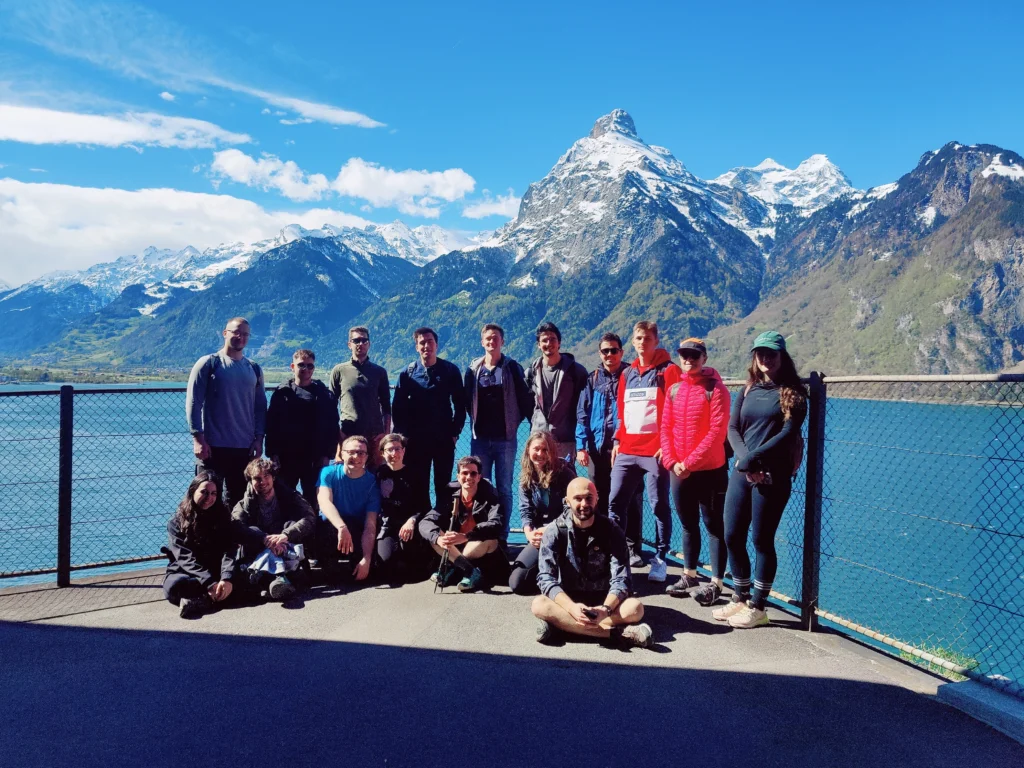 Group photo of ARICH members and Google friends in front of a Swiss lake